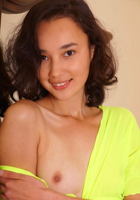 Rangy brunette teen Djessy reveals her ass and hairy pussy 