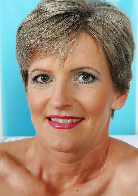 Very attractive mature Melanie in sexy skirt exposing tiny tits and masturbating 