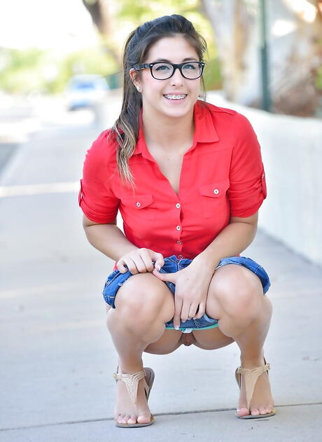 Foxy american teen Natalie Monroe in shorts exposes big titties and cute pussy outdoor